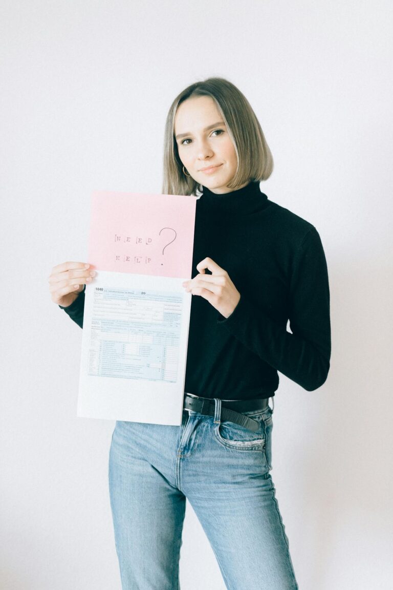 Woman in Black Long Sleeve Turtleneck Shirt Holding Tax Forms and Offering Help 